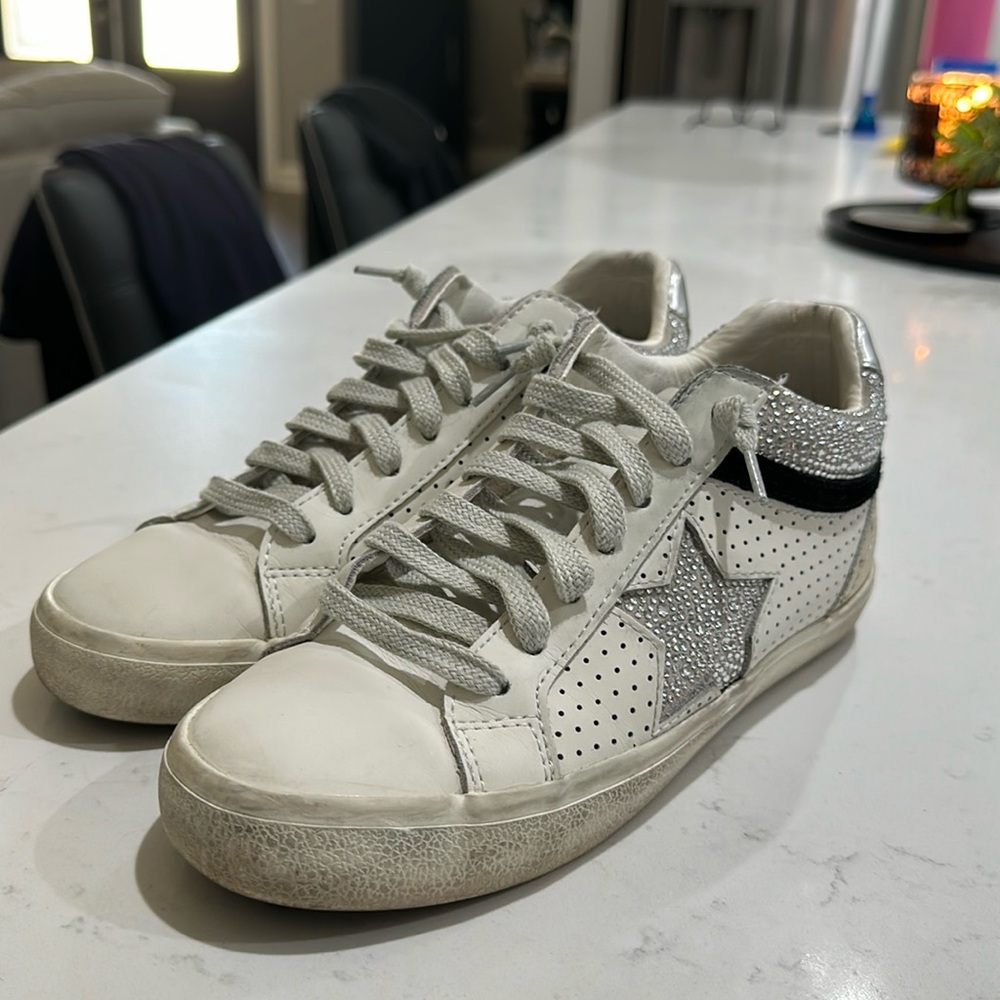 Like new Vintage Havana, white, black, silver, & gold with grey laces, size 7